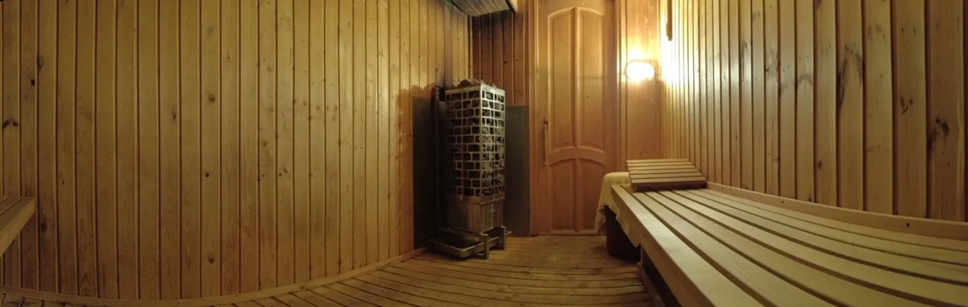 Panorama of sauna benches with wood-panelled walls