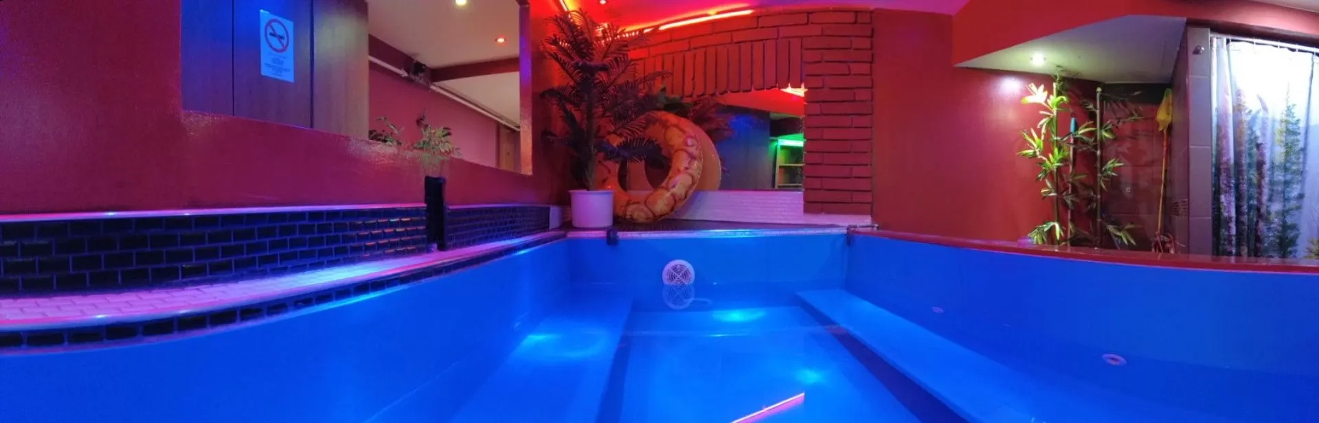 Panoramic view of the jacuzzi pool with glowing blue water