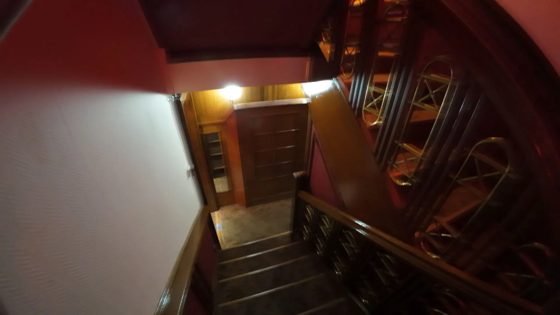 Stairs leading down from the entrance in warm light