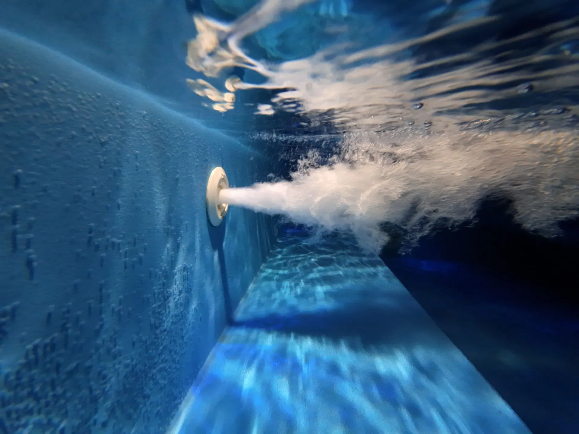 Underwater: the jacuzzi jet streaming bubbles