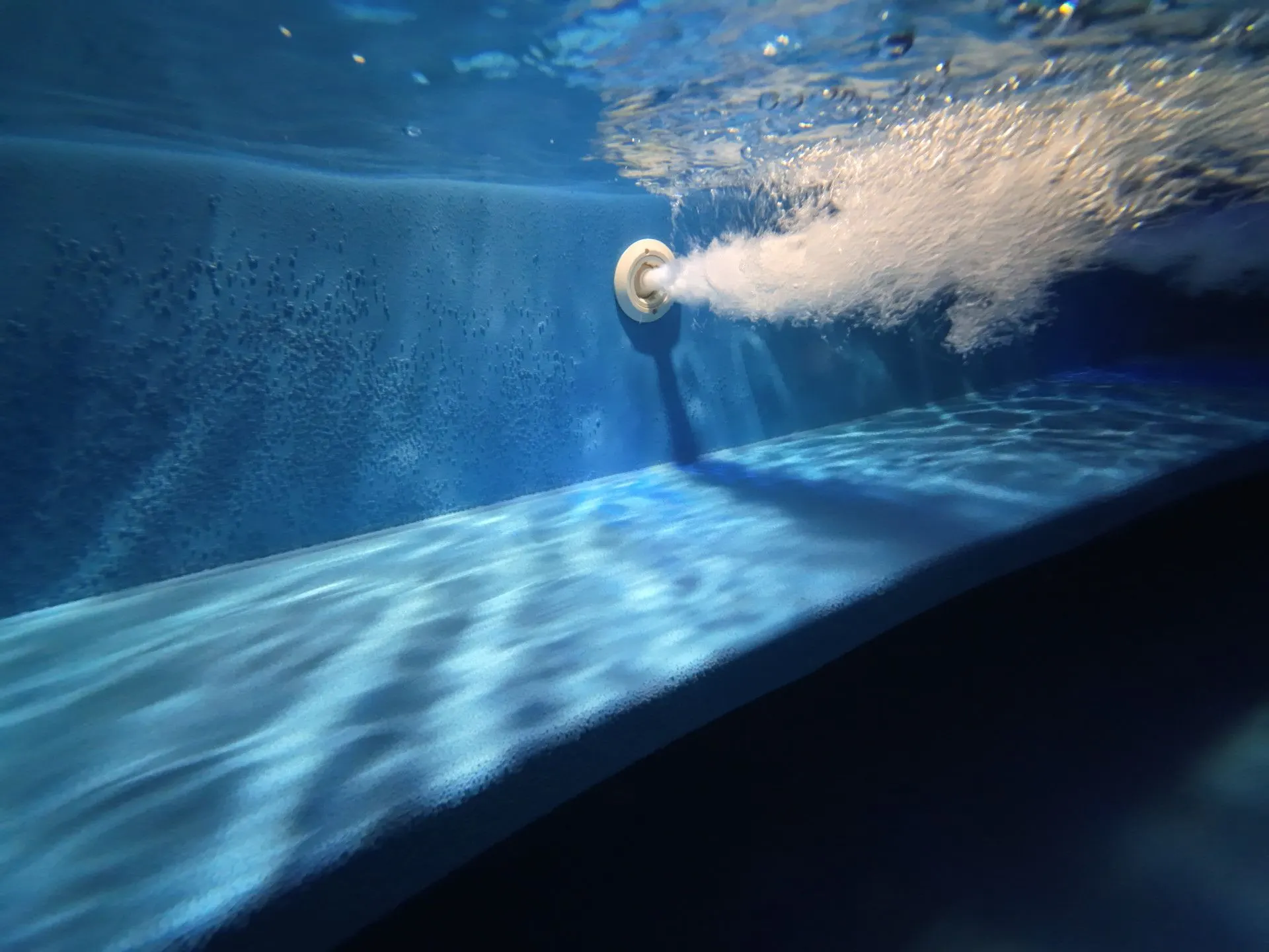 Underwater play of light on the jacuzzi wall